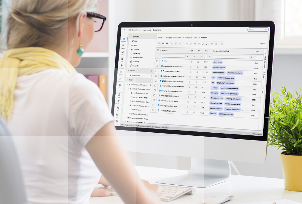 A woman looking at Datasite's due diligence data room on her computer