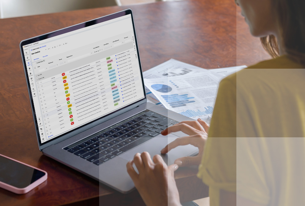 Woman using laptop to access Datasite Cloud™ for virtual dealmaking